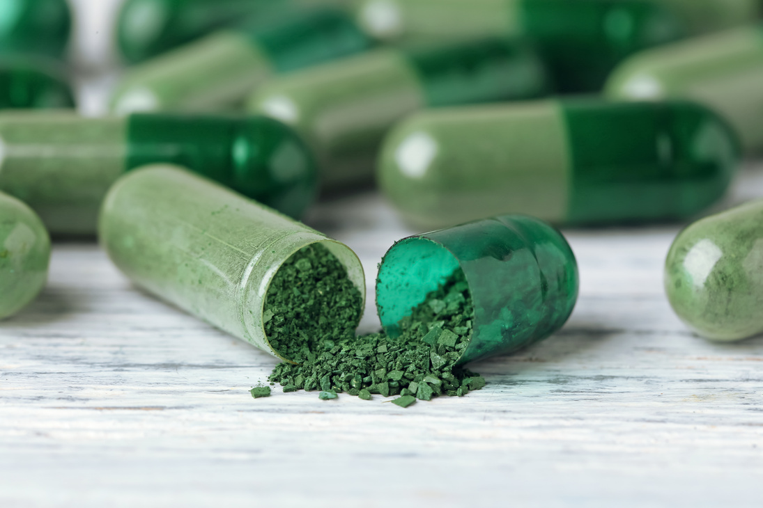 Spirulina Capsules on Table, Close up
